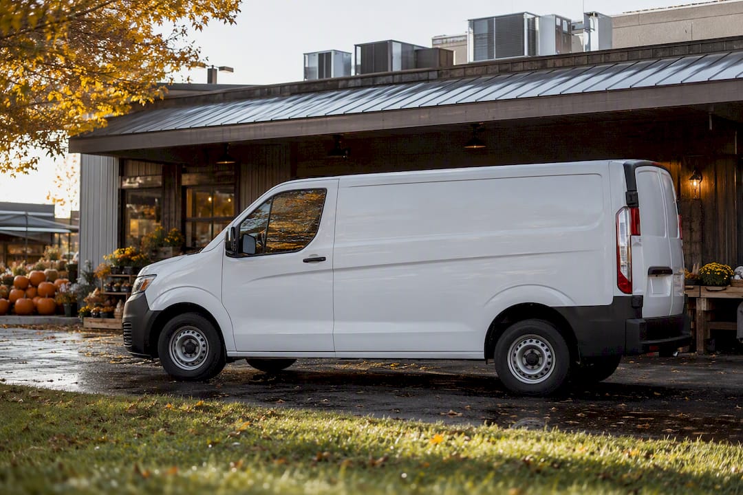 HVAC service vehicle outside local shop in morning